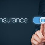 A graphic representing a computer screen, with a man in a business suit toggling a button that reads, "Insurance."